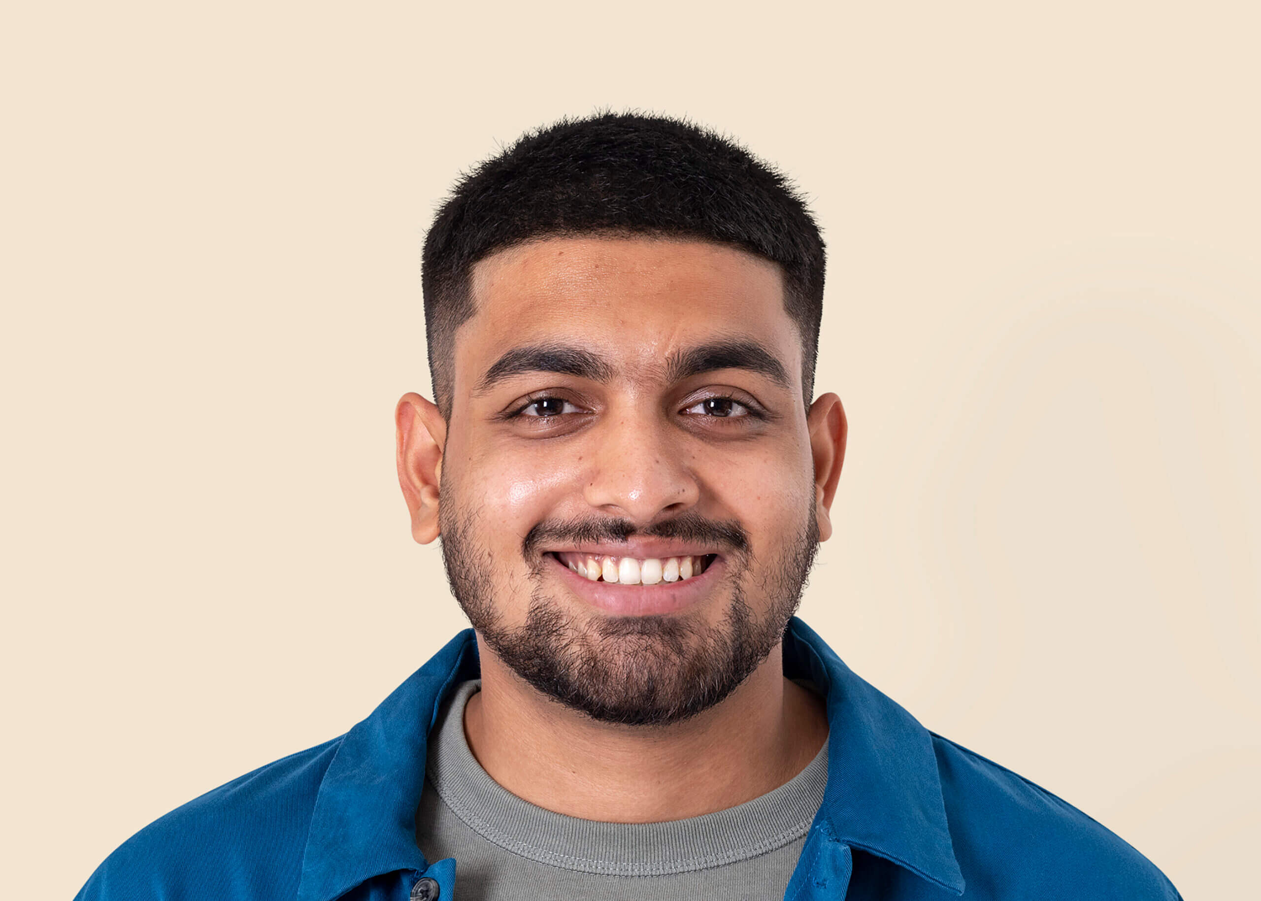 indian-man-smiling-mockup-psd-cheerful-expression-closeup-portra-scaled (1)